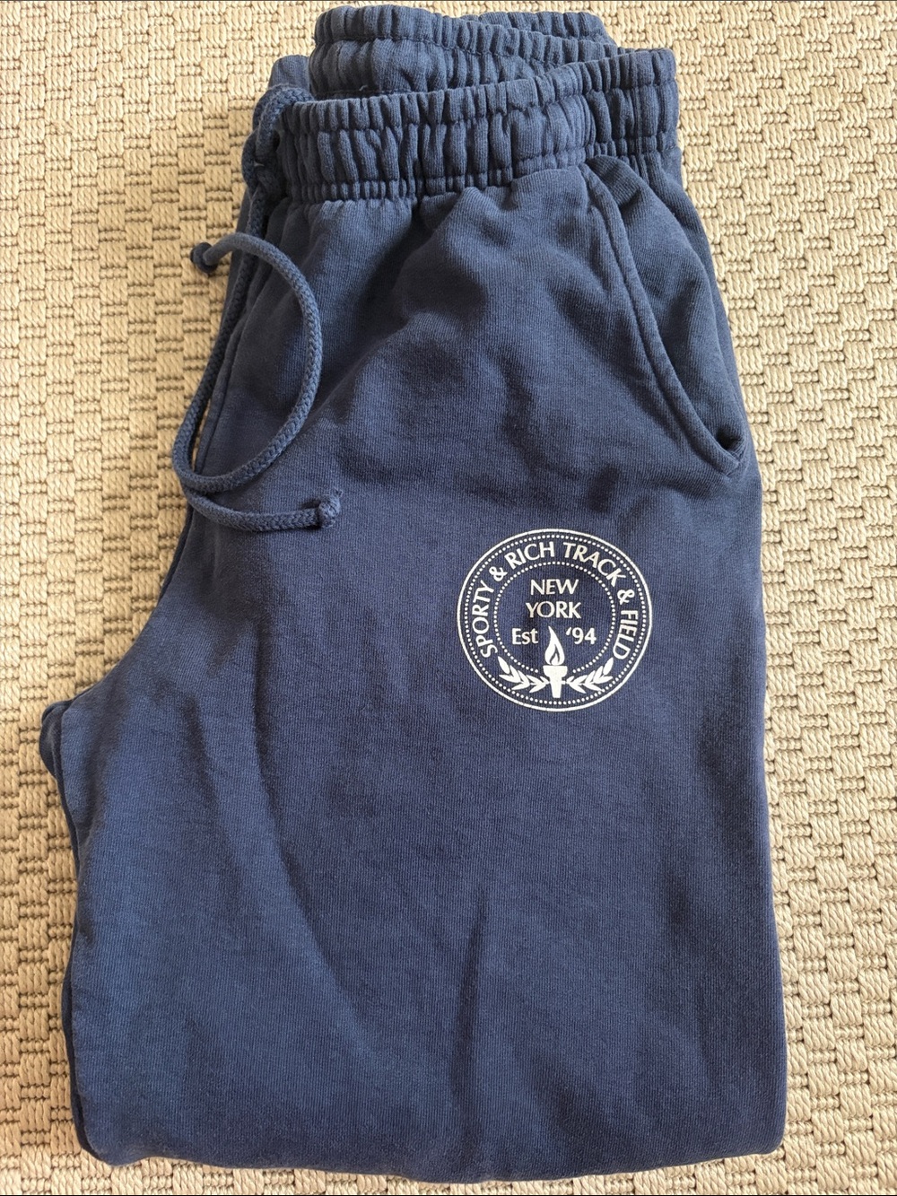 Sporty & Rich Navy Sweatpants with White New York Crest